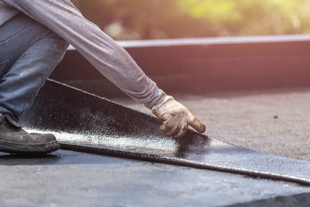 Professional Waterproofing technician working in Irvington, AL